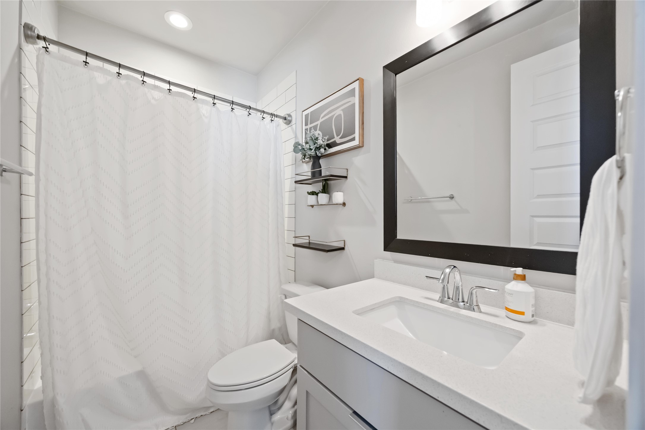 4235 Allen Street Houston, TX 77007 - Photo 18 of 23 a bathroom with a sink and a mirror