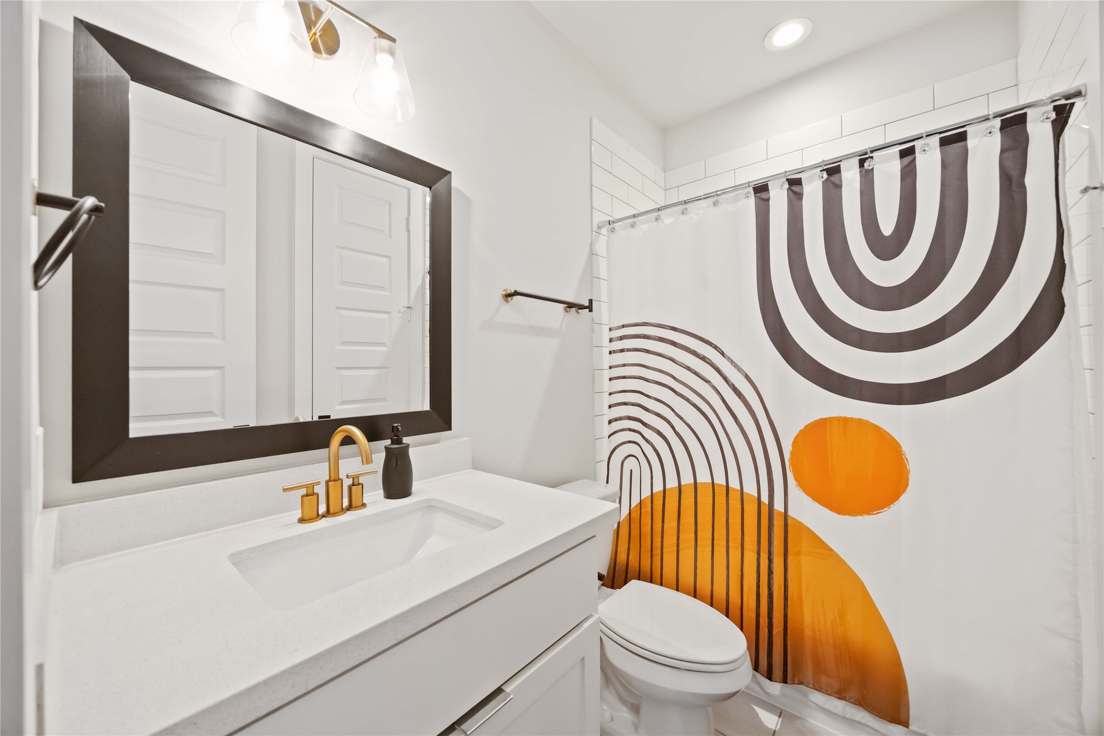 4235 Allen Street Houston, TX 77007 - Photo 21 of 23 a bathroom with a sink a mirror a toilet and a mirror