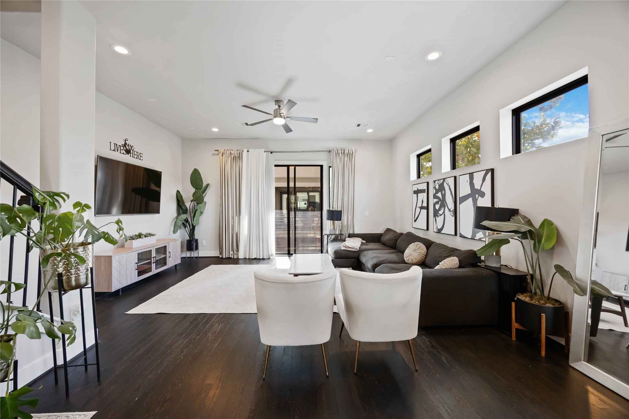 4235 Allen Street Houston, TX 77007 - Photo 5 of 23 a living room with furniture a flat screen tv and a large window