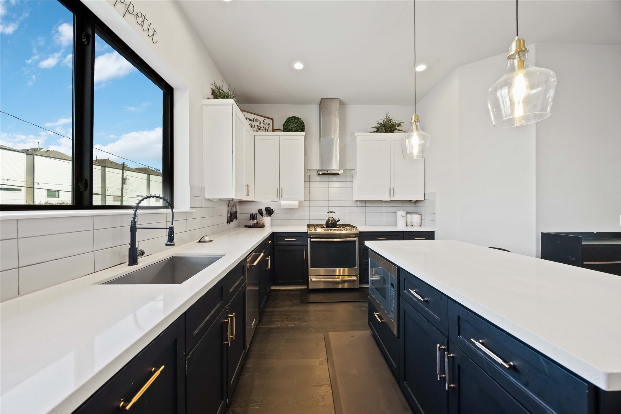 4235 Allen Street Houston, TX 77007 - Photo 8 of 23 a kitchen with a sink stove and cabinets