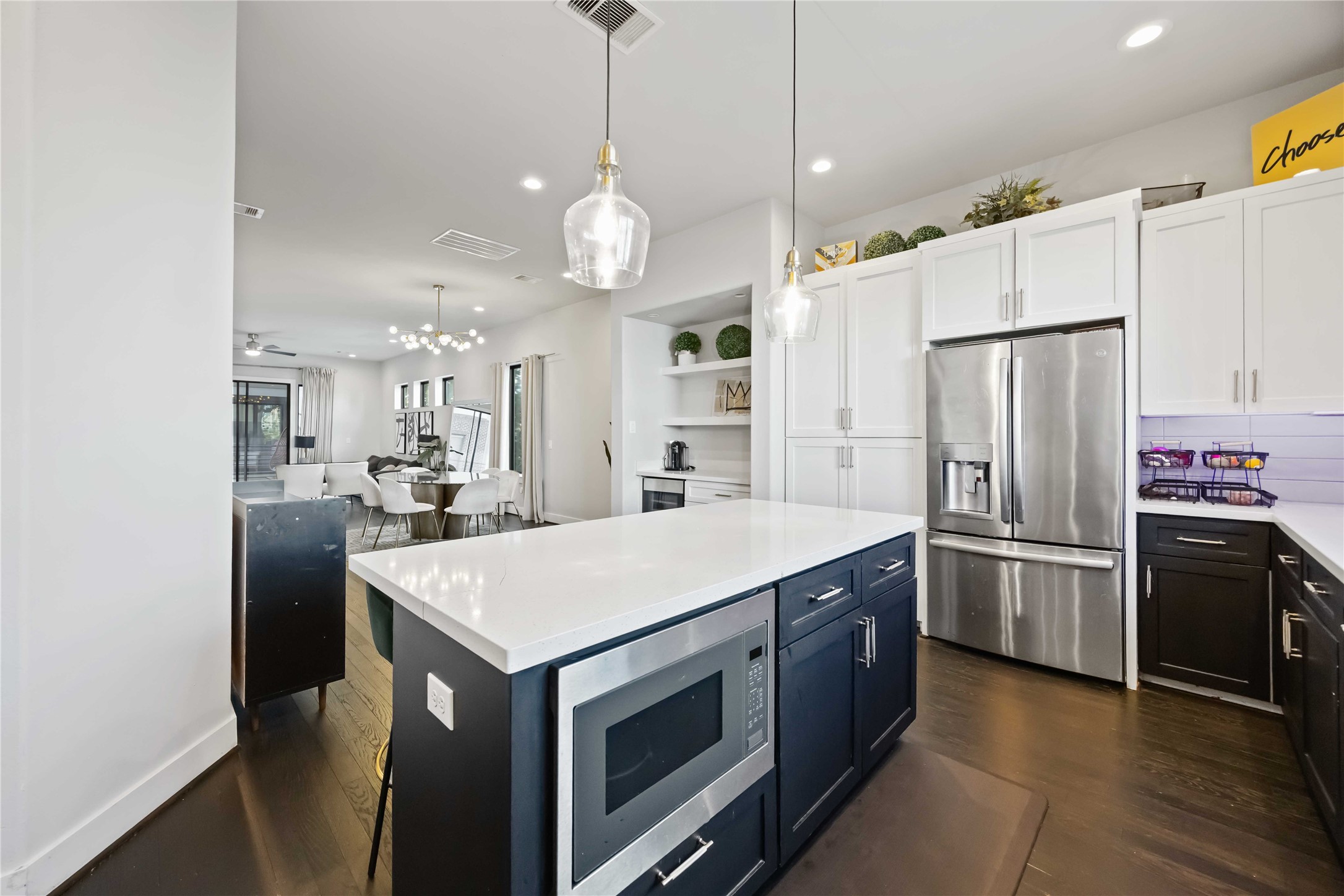 4235 Allen Street Houston, TX 77007 - Photo 9 of 23 a large kitchen with stainless steel appliances a stove center island a refrigerator and a fireplace