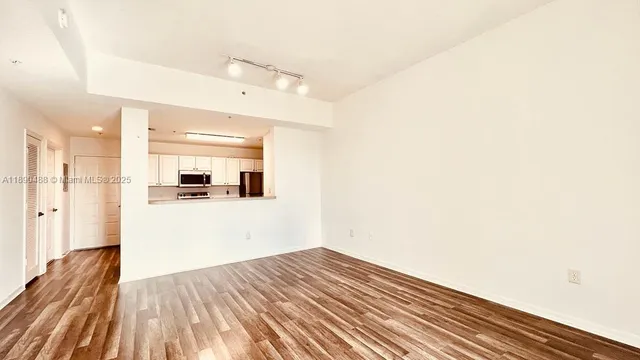 a view of a livingroom with wooden floor