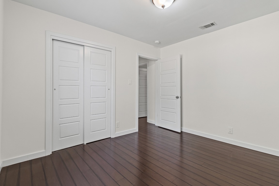 6305 Vioitha Drive, Unit B Austin, TX 78723 - Photo 17 of 23 a view of an empty room with wooden floor