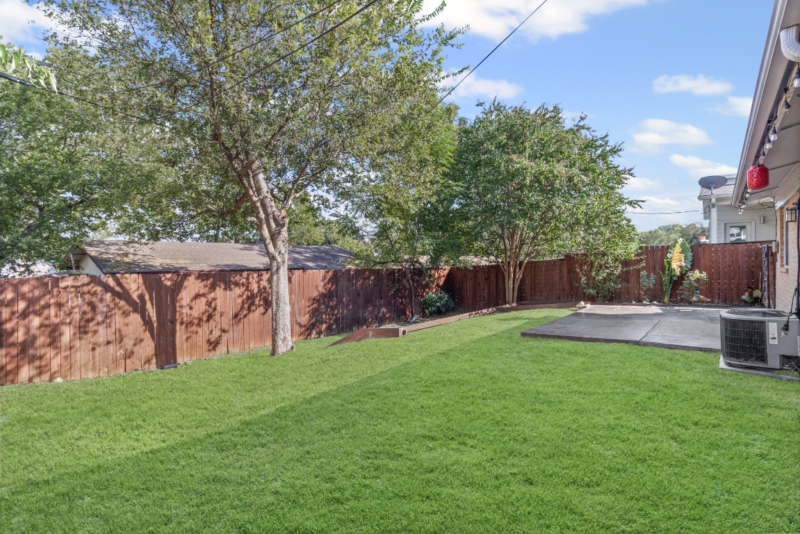 6305 Vioitha Drive, Unit B Austin, TX 78723 - Photo 18 of 23 a view of a backyard with sitting area