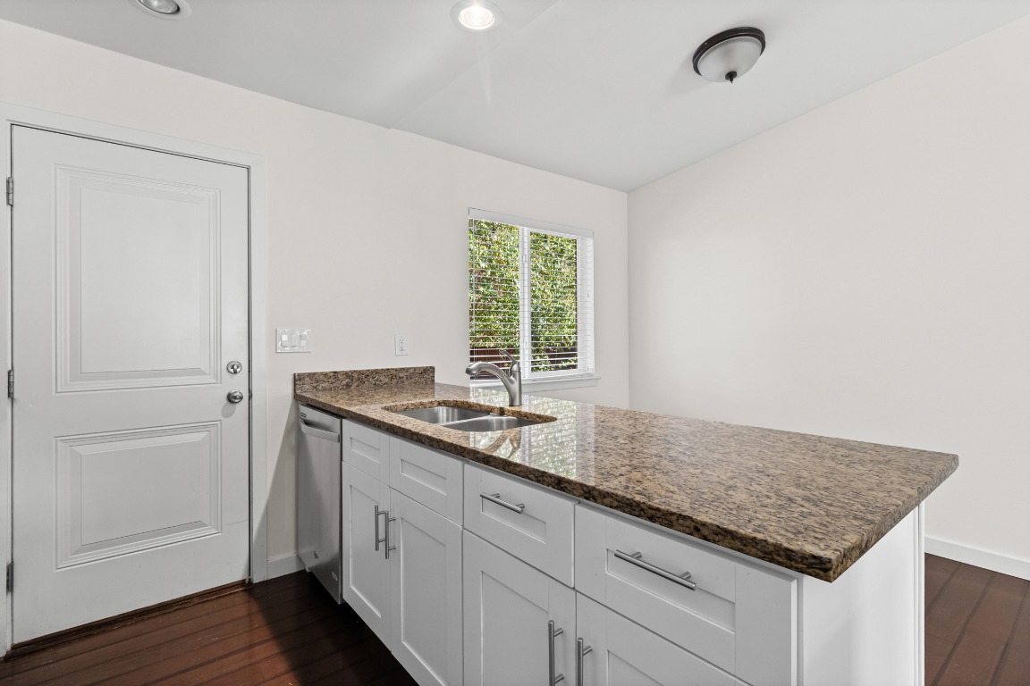 6305 Vioitha Drive, Unit B Austin, TX 78723 - Photo 8 of 23 a kitchen with sink and window