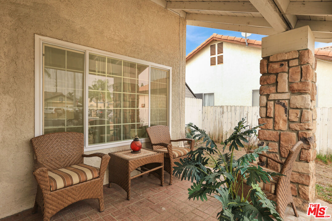 14361 Rio Bravo Road Moreno Valley, CA 92553 - Photo 31 of 34 a living room with furniture and a window