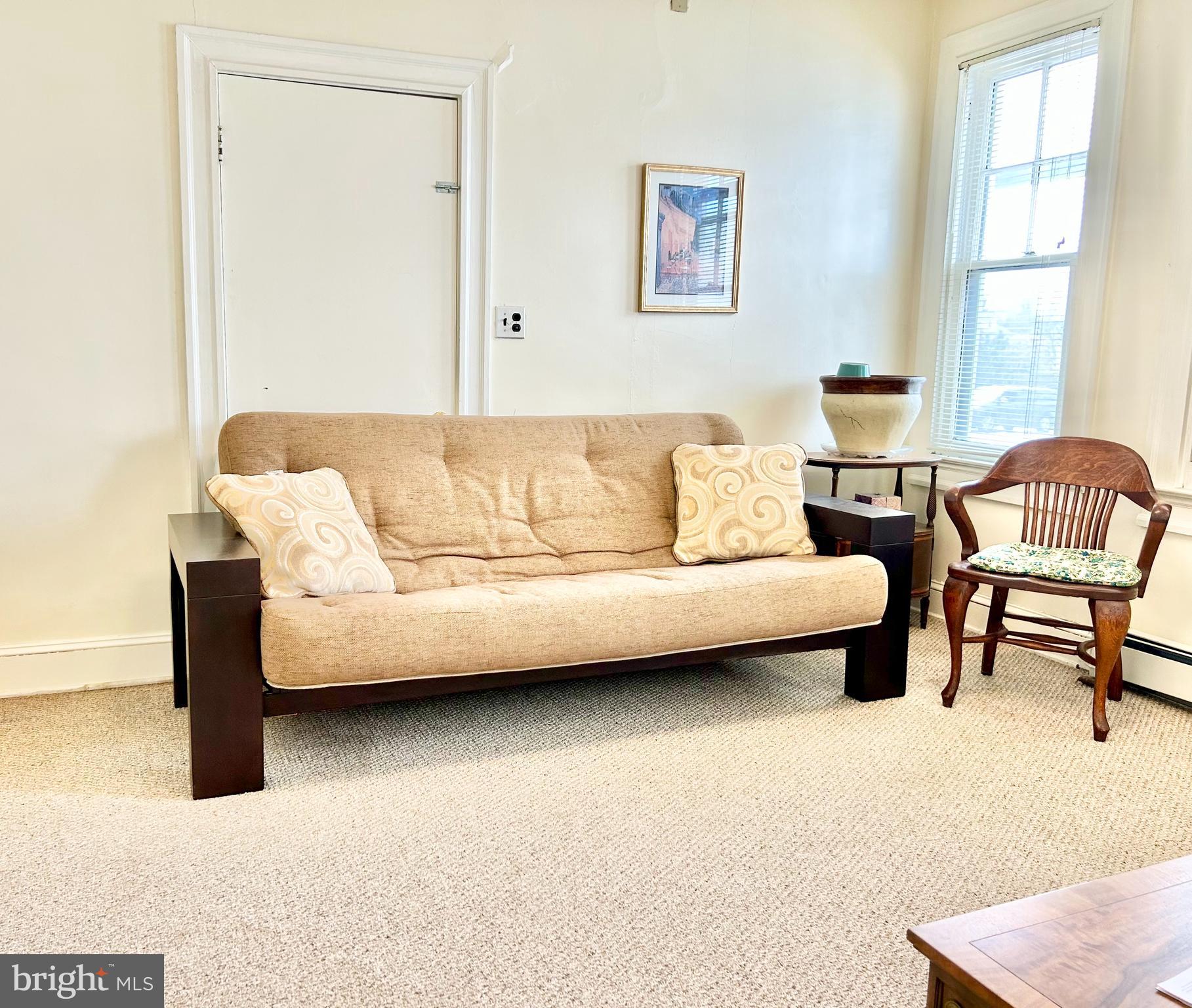 5904 Harford Road Baltimore, MD 21214 - Photo 9 of 23 a living room with furniture and a window