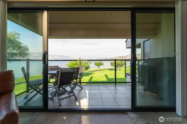 a view of two chairs in the balcony
