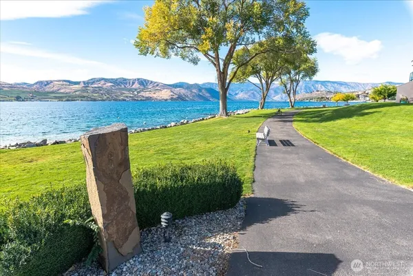 a view of a garden with an ocean