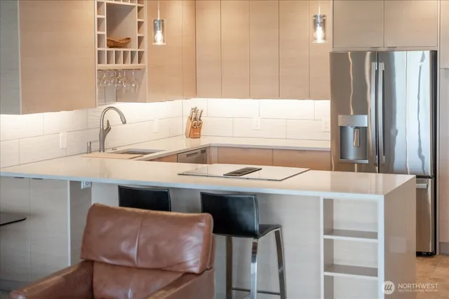 a kitchen with a sink cabinets and appliances