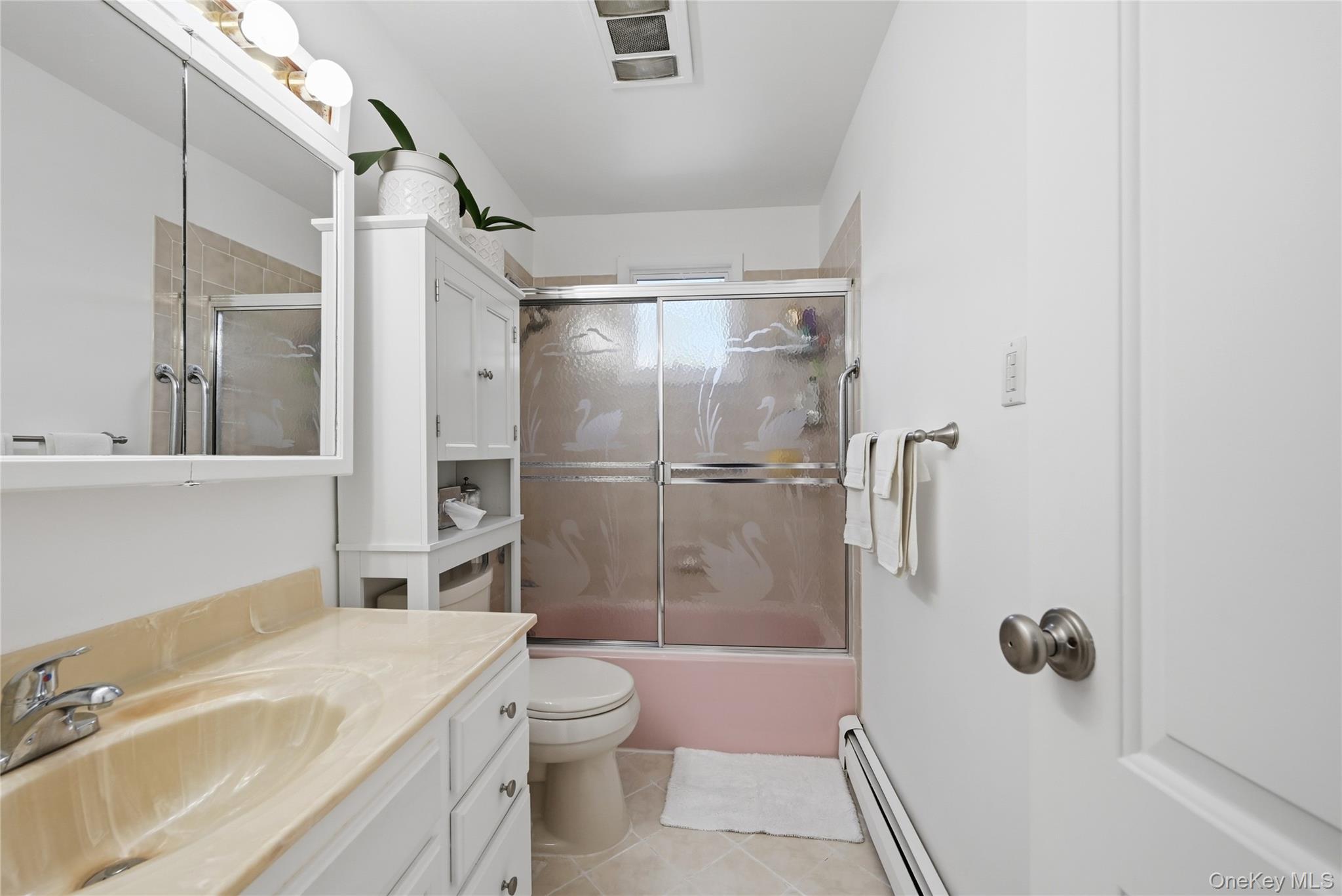 35 Randall Road Shoreham, NY 11786 - Photo 16 of 32 a bathroom with a sink toilet and shower