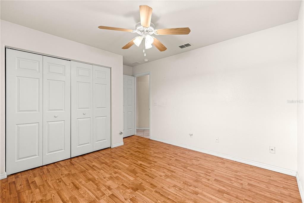 9958 Southwest 59th Circle Ocala, FL 34476 - Photo 23 of 56 wooden floor in an empty room