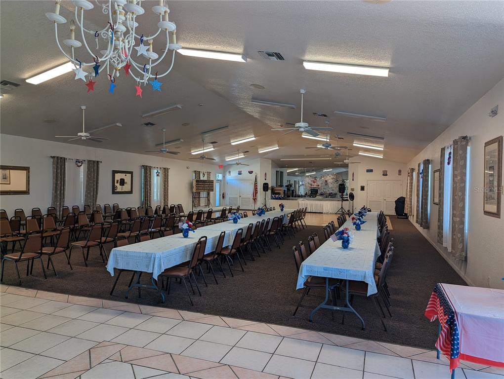 9958 Southwest 59th Circle Ocala, FL 34476 - Photo 48 of 56 a living room with lots of furniture and view of kitchen
