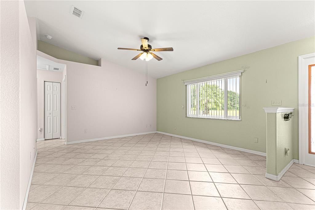 9958 Southwest 59th Circle Ocala, FL 34476 - Photo 10 of 56 a view of an empty room with a window