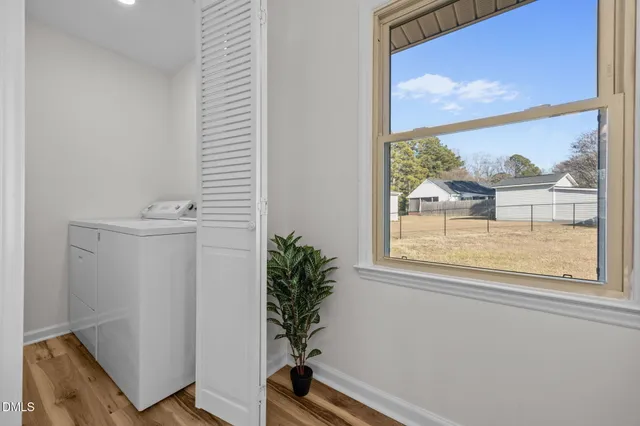 a kitchen with a refrigerator stove and white cabinets