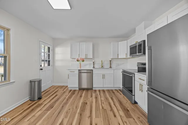 a kitchen with a stove and a microwave