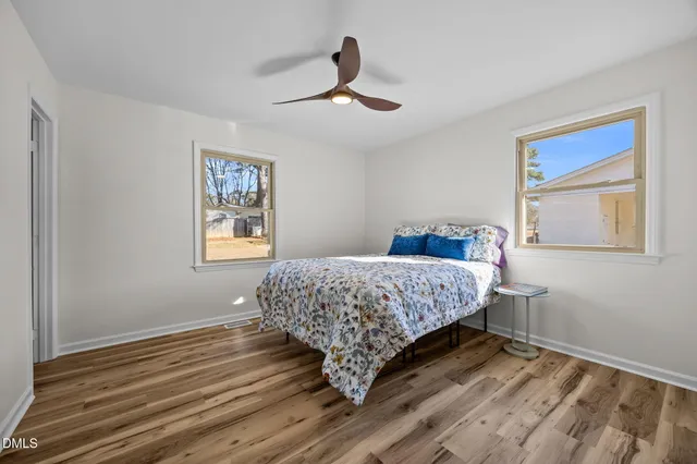 a bedroom with bed and a window