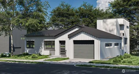 a house that has a tree in front of it