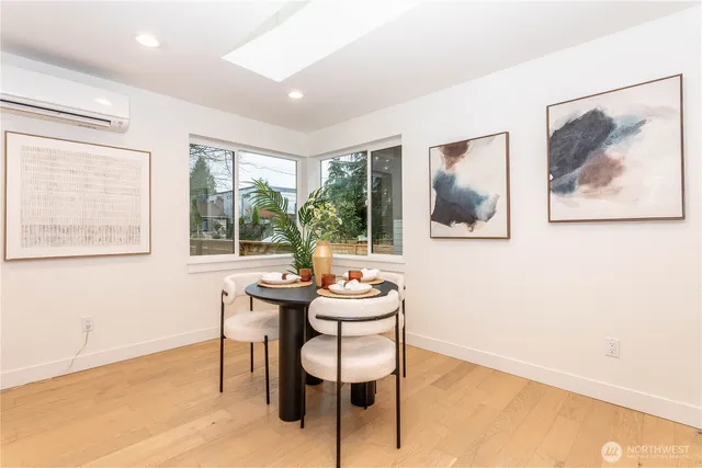 a dining room with furniture and window