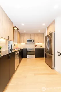 a bathroom with a double vanity sink mirror and
