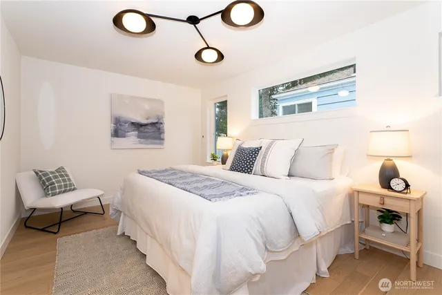 a bedroom with a bed and a chair