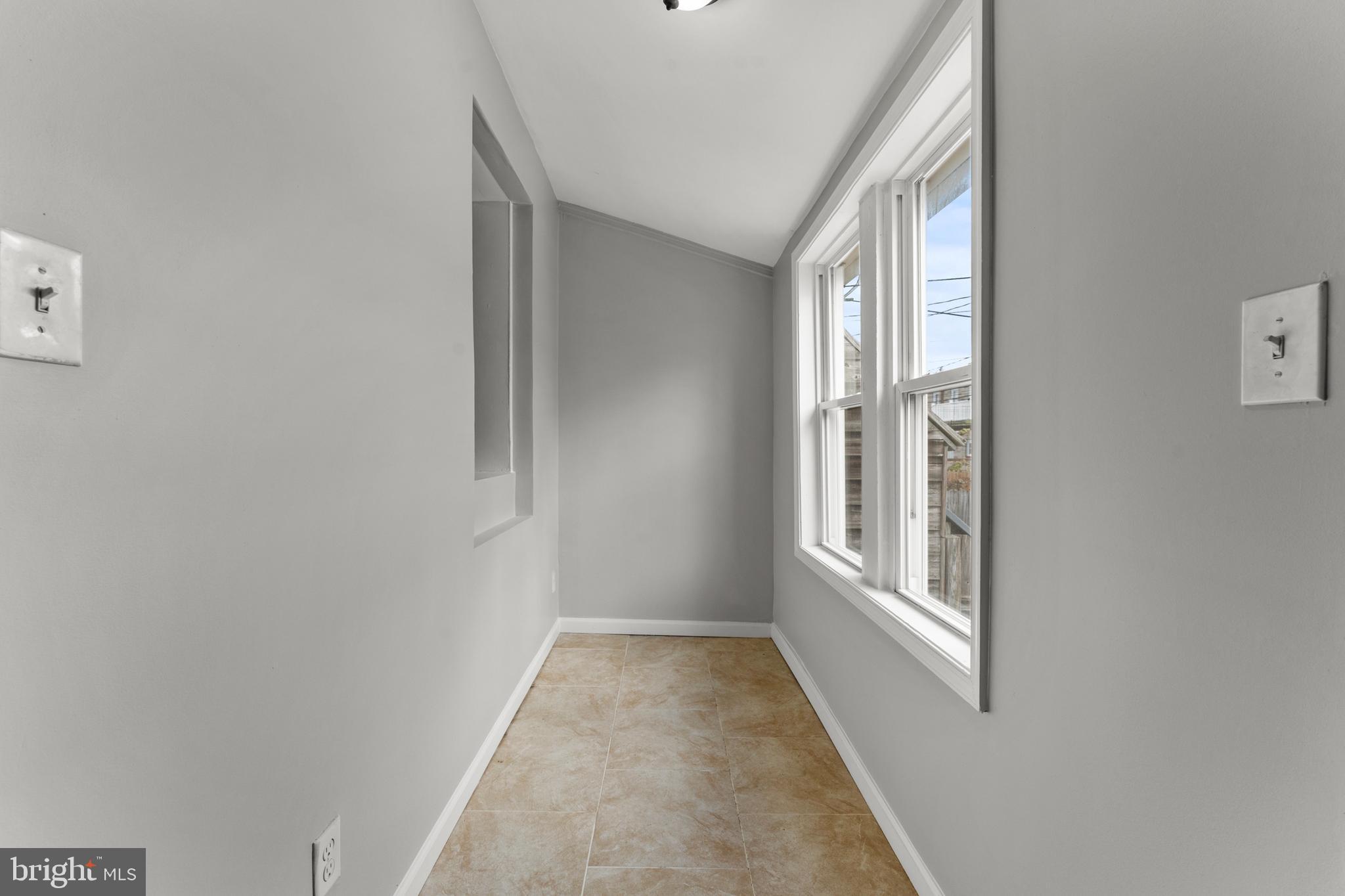 1249 Carroll Street Baltimore, MD 21230 - Photo 15 of 29 a view of a hallway with windows
