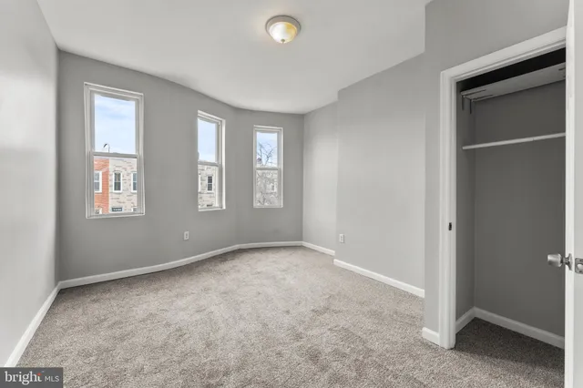 a view of an empty room with windows