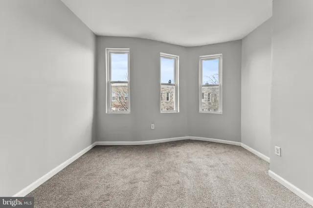 an empty room with windows