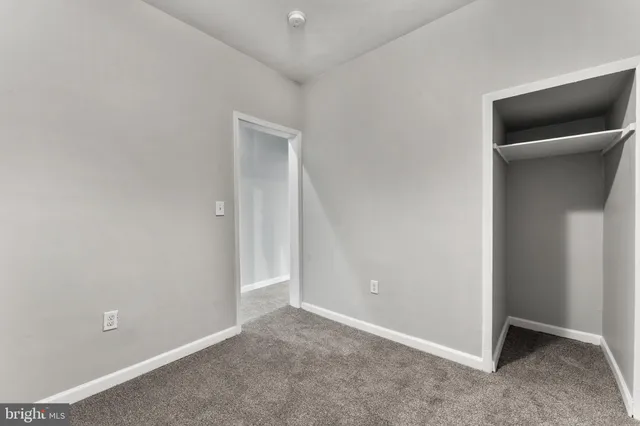 an empty room with a hallway