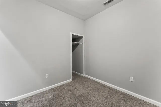 an empty room with closet