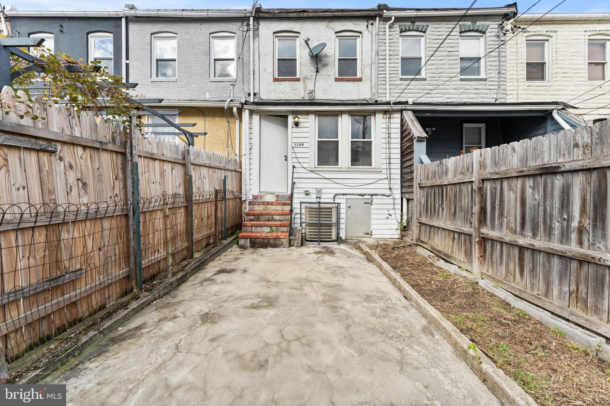 1249 Carroll Street Baltimore, MD 21230 - Photo 29 of 29 a view of a house with wooden fence