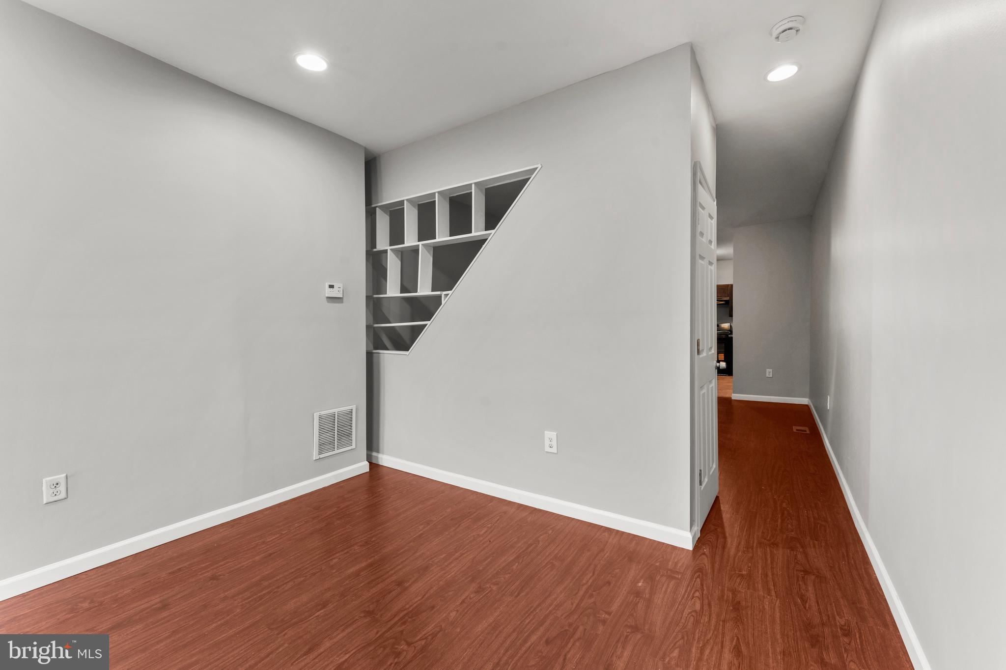 1249 Carroll Street Baltimore, MD 21230 - Photo 4 of 29 a view of hallway with wooden floor