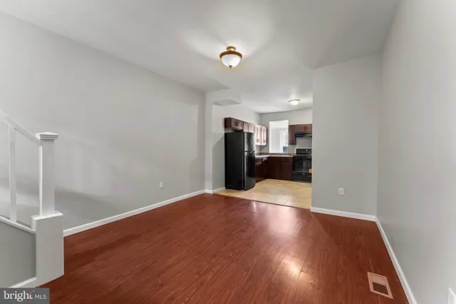 a view of a livingroom with wooden floor