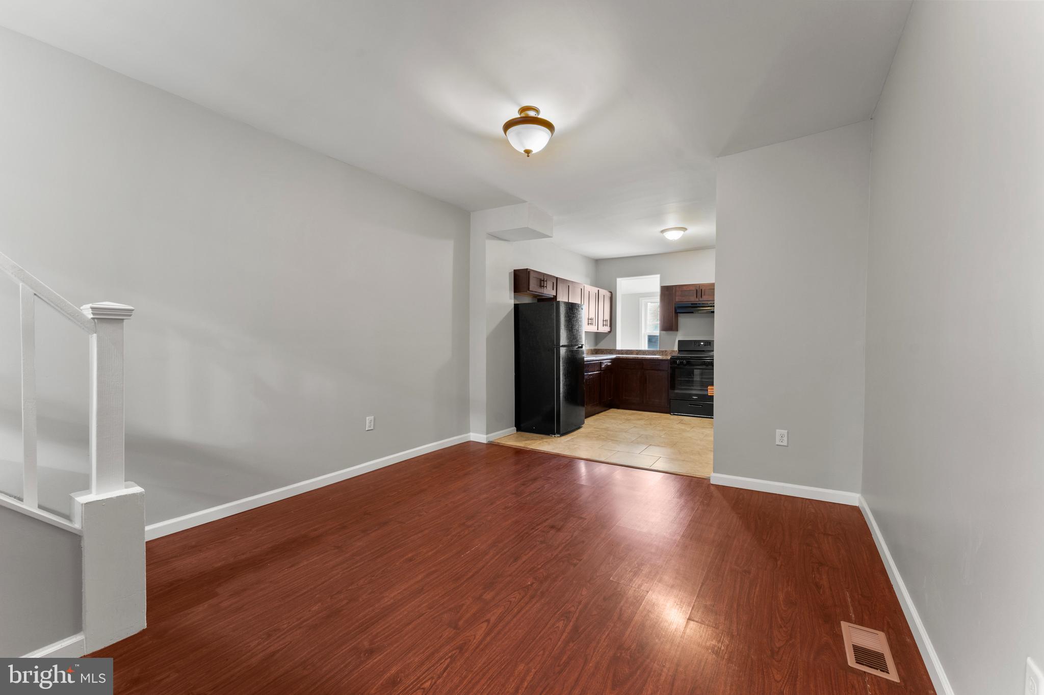 1249 Carroll Street Baltimore, MD 21230 - Photo 6 of 29 a view of a livingroom with wooden floor