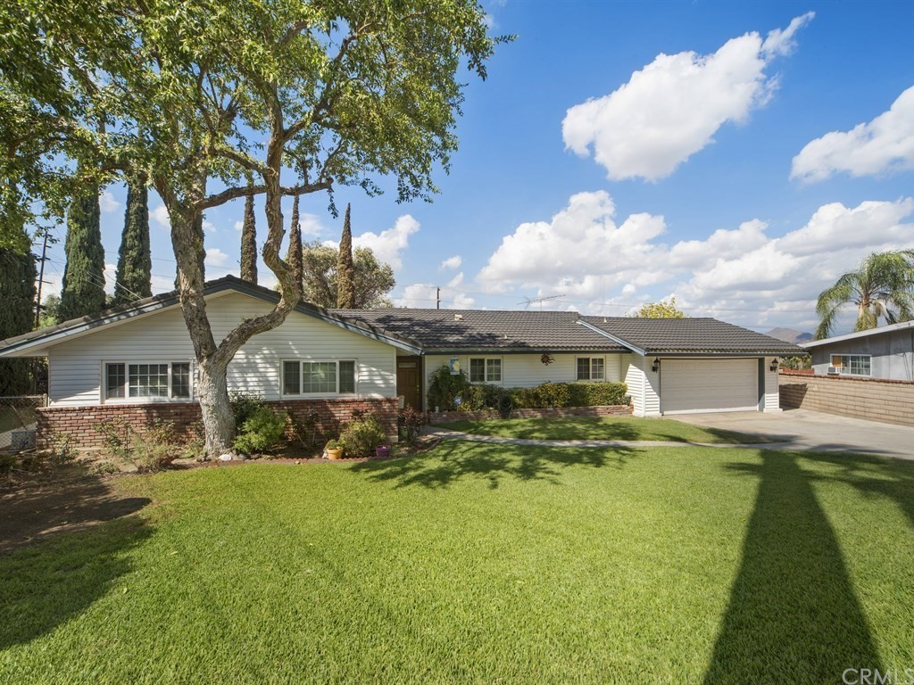5965 Tucson Court Riverside, CA 92504 - Photo 1 of 1 a front view of a house with a yard