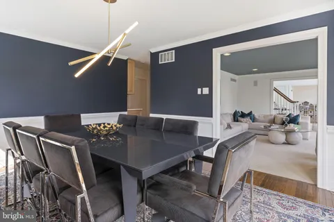 a kitchen with stainless steel appliances granite countertop a refrigerator and a stove