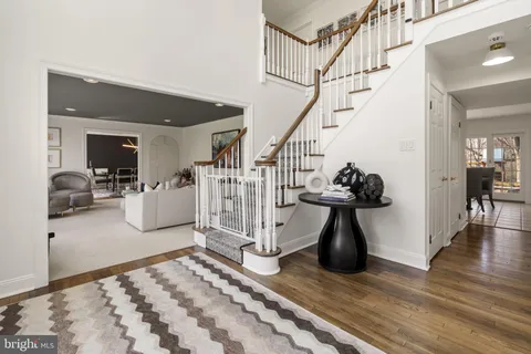 a living room with lots of furniture and white walls
