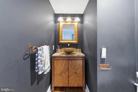 a bathroom with a sink and mirror