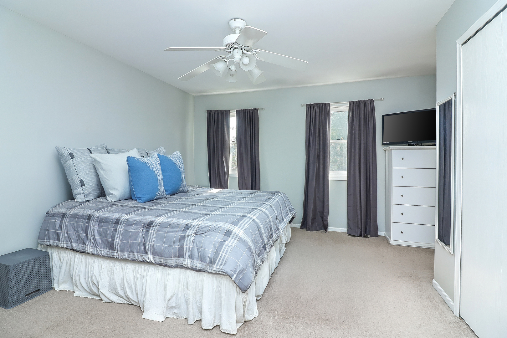 3 Hickory Oaks Court Bolingbrook, IL 60490 - Photo 12 of 21 a bedroom with a large bed and a chandelier