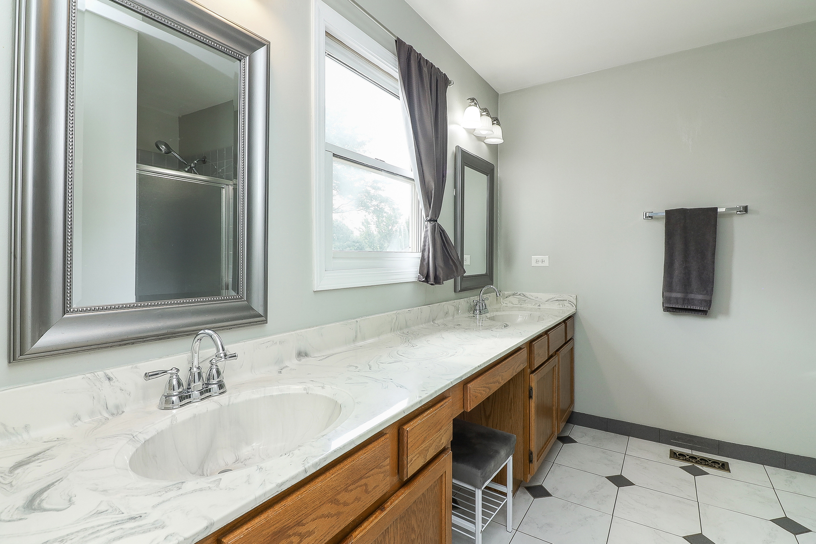 3 Hickory Oaks Court Bolingbrook, IL 60490 - Photo 13 of 21 a bathroom with a granite countertop sink and a window