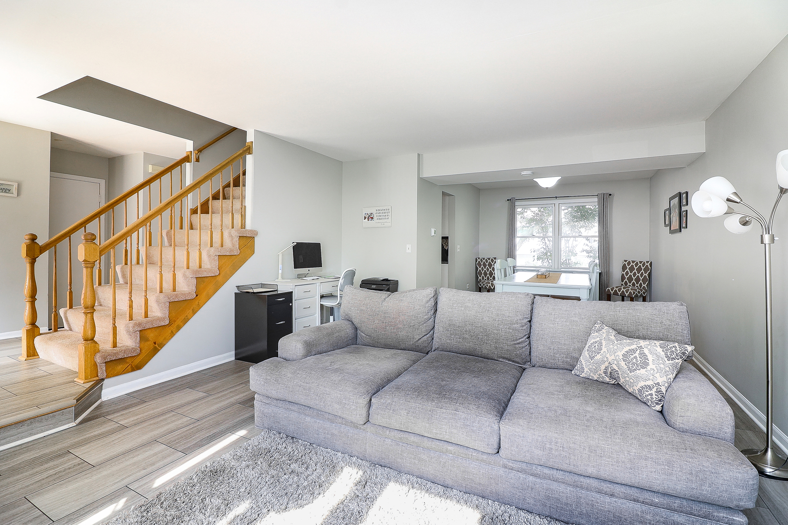 3 Hickory Oaks Court Bolingbrook, IL 60490 - Photo 2 of 21 a living room with furniture or stairs and a wooden floor