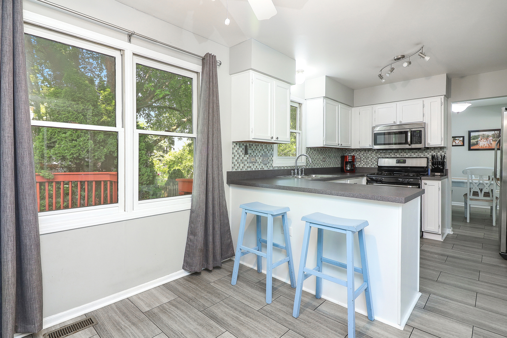 3 Hickory Oaks Court Bolingbrook, IL 60490 - Photo 8 of 21 a kitchen with stainless steel appliances granite countertop a stove a sink and a refrigerator