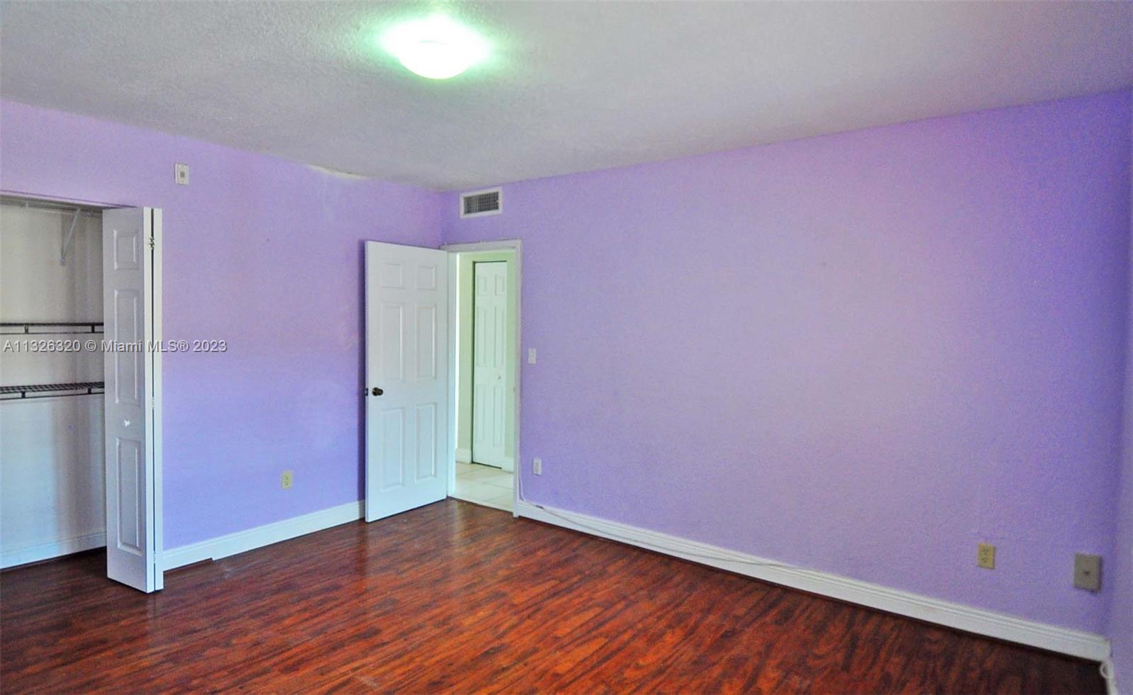 9972 Southwest 88th Street, Unit 1121 Miami, FL 33176 - Photo 6 of 7 a view of empty room with wooden floor