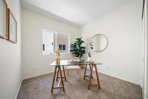 a bedroom with a bed and a couch