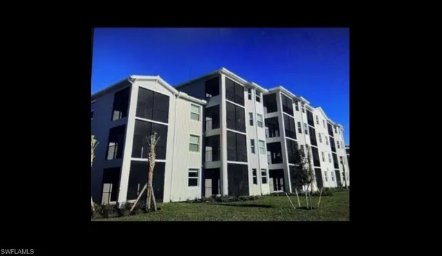 a view of a building with a yard