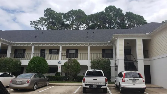 a view of a car parked in front of a house