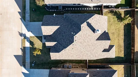 an aerial view of a house with swimming pool