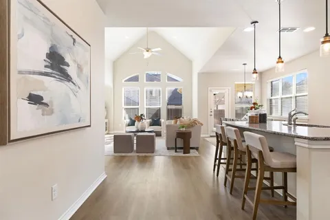 a very nice looking dining room with a large window