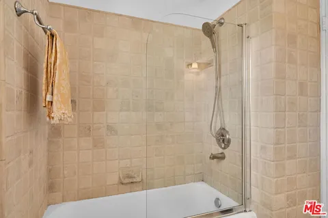 a bathroom with a shower and a toilet
