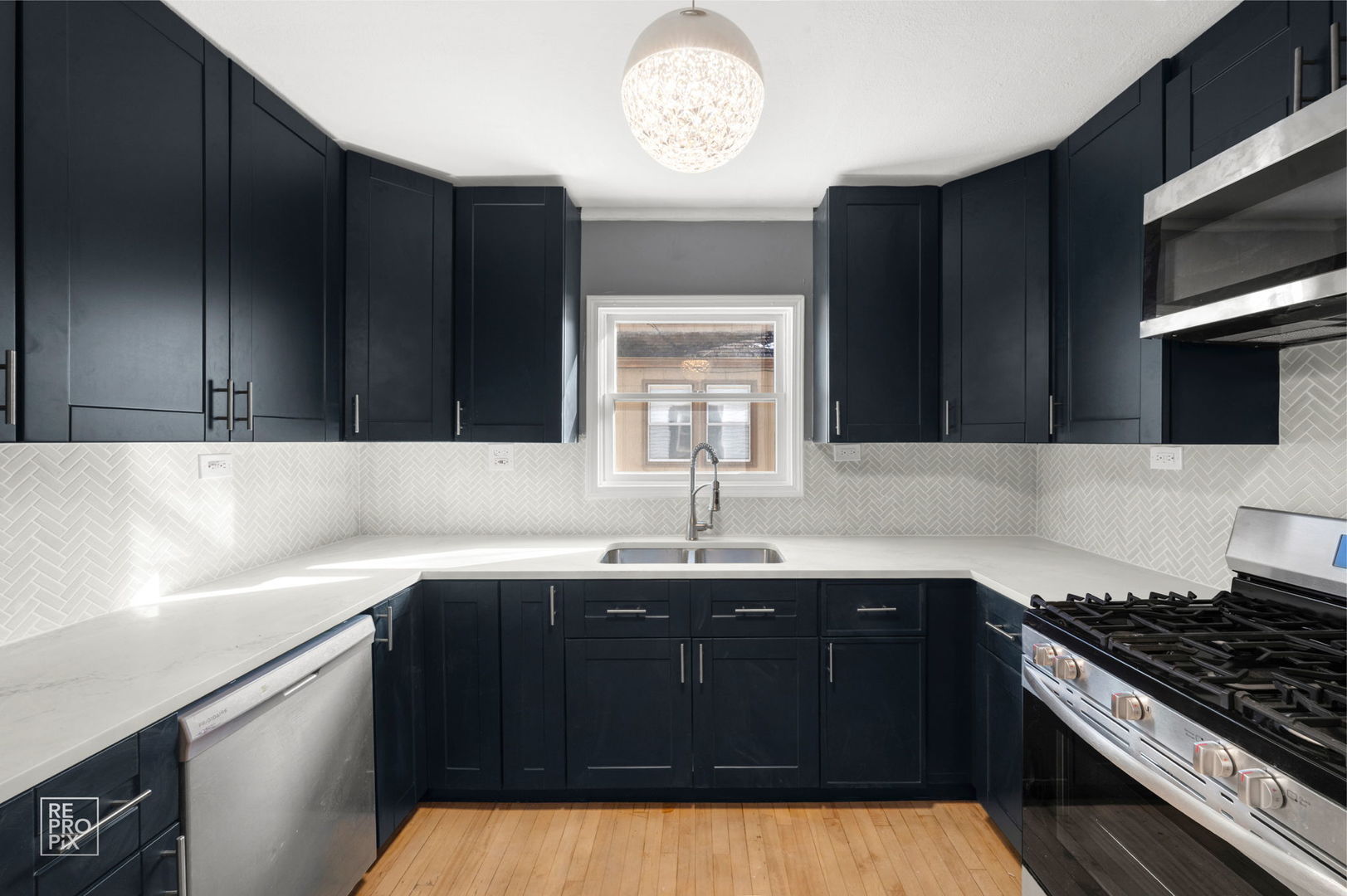 1621 Burr Oak Road Homewood, IL 60430 - Photo 4 of 10 a kitchen with a sink a stove and cabinets